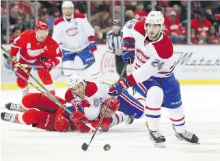  ?? PAUL SANCYA/THE ASSOCIATED PRESS ?? Canadiens forward Phillip Danault, seen here heading up the ice with the puck during Montreal’s 1-0 loss to the Red Wings on Monday, has been a pleasant surprise for Habs fans.