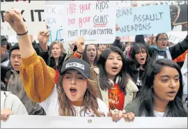  ?? ANDA CHU — STAFF PHOTOGRAPH­ER ?? Valley Christian High School student Nia Lopez-Salmons, 18, left, marches in San Jose.