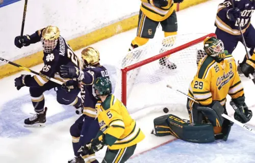  ?? CHARLES KRUPA/AP ?? Notre Dame’s Cam Morrison (26) celebrates his winning goal in overtime against Clarkson during an NCAA regional game in 2019.