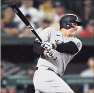  ?? Gail Burton / Associated Press ?? The Yankees’ Anthony Rizzo follows through on a double against the Orioles on Thursday in Baltimore.