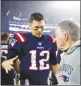  ?? Tribune News Service/getty images ?? Tom Brady #12 of the
New England Patriots congratula­tes head coach Bill Belichick on his 300th win.