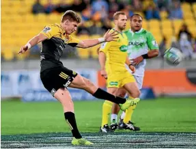  ??  ?? Jordie Barrett clears the ball last night.