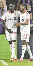  ?? PHELAN M. EBENHACK / AP ?? Toronto FC forward Prince Owusu, left, celebrates his goal against Orlando City with Tyrese Spicer during second-half MLS action Saturday in Orlando, Fla. Toronto won the game 2-1.