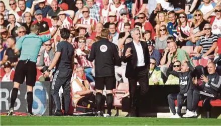  ?? REUTERS PIC ?? Referee Craig Pawson (left) sends Manchester United manager Jose Mourinho to the stands as fourth official Mike Jones looks on on Saturday.