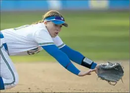  ?? Kyusung Gong Associated Press ?? MEGAN GRANT, who led UCLA with 58 RBIs last season and earned secondteam All-American honors, says she’s “excited to prove ourselves again.”