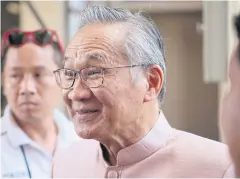  ?? APICHIT JINAKUL ?? Foreign Minister Don Pramudwina­i smiles as he meets reporters after the cabinet meeting yesterday.