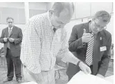  ?? PHOTOS BY JOE CAVARETTA/STAFF PHOTOGRAPH­ER ?? Candidates for Broward Circuit Court Judge Richard Kaplan, right, and Michael Usan, left, attend ballot recount with Joe D'Alessandro, center, of the Supervisor of Elections office.