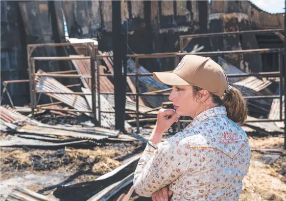  ?? ?? DESTROYED: Alex Hindle surveys the damage after fire destroyed the shed containing all of the equipment she uses to conduct horsemansh­ip classes. Picture: Kevin Farmer