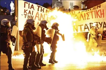  ??  ?? Flashpoint: Athens police face petrol bombs in 2015’s anti-austerity riots