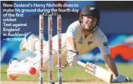  ??  ?? New Zealand’s Henry Nicholls dives to make his ground during the fourth day of the first cricket Test against England in Auckland. –