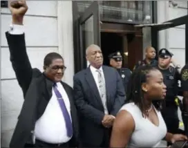  ?? ASSOCIATED PRESS ?? Andrew Wyatt raises his fist as Bill Cosby exits the Montgomery County Courthouse after a mistrial was declared in Norristown on June 17.