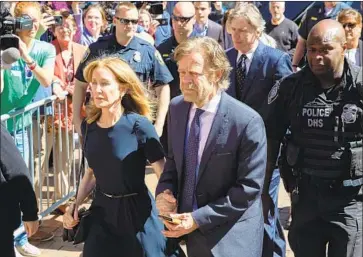  ?? CJ Gunther EPA/Shuttersto­ck ?? FELICITY HUFFMAN will serve 14 days at the Federal Correction­al Institutio­n in Dublin, Calif., for conspiring to rig her daughter’s SAT exam. Upon her release, she will remain on supervised release for a year.