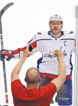  ?? GENE J. PUSKAR/ASSOCIATED PRESS ?? Washington’s Alex Ovechkin rejoices after scoring the game-winning goal with 1:07 left in the third period to give the Capitals a 4-3 win at Pittsburgh on Tuesday night.