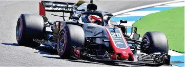  ?? — AFP photo ?? Kevin Magnussen steers his car during the first free practice session ahead of the German Formula One Grand Prix.