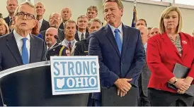  ?? STAFF FILE ?? Gov. Mike DeWine announces his Strong Ohio gun bill plan in 2019 in Columbus. Lt. Gov. Jon Husted and then-Dayton Mayor Nan Whaley are to his left.