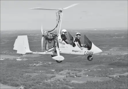  ?? SUBMITTED PHOTO ?? Neil Laubach, left, and Rick Mercer in a gyrocopter over Waterloo Region. The segment will be in the Rick Mercer Report on Tuesday night.