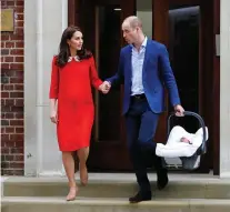  ?? KIRSTY WIGGLESWOR­TH/THE ASSOCIATED PRESS ?? Britain’s Prince William and Kate, Duchess of Cambridge, leave a hospital in London just after their baby son George was born. With another royal baby on the horizon, debates over postpartum perfection are already lighting up in some social media circles — never mind what the baby will look like.