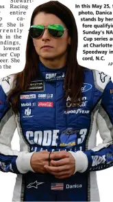  ?? AP PHOTO BY CHUCK BURTON ?? In this May 25, file photo, Danica Patrick stands by her car before qualifying for Sunday's NASCAR Cup series auto race at Charlotte Motor Speedway in Concord, N.C.