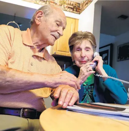  ?? CARLINE JEAN/SOUTH FLORIDA SUN SENTINEL ?? Irving Brown, 95, and wife Esther, 92, of Delray Beach, have not been able to get a spot in line for the COVID-19 vaccinatio­n. The couple doesn’t own a computer, which is necessary for making an appointmen­t.