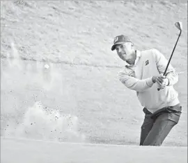  ?? Christian Petersen Getty Images ?? MATT KUCHAR MATCHED Jordan Spieth almost shot for shot until a double bogey on the 16th hole. Here he hits out of bunker on the 17th, en route to a birdie.