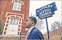  ?? [CHRIS LANDSBERGE­R, THE OKLAHOMAN] ?? J.D. Baker walks in front of the former Calvary Baptist Church. The special assistant to Mayor David Holt said he got his start in public speaking through church.