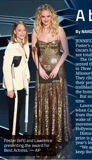  ?? — AP ?? Foster (left) and Lawrence presenting the award for Best Actress.
