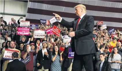  ?? PHOTO: REUTERS ?? Man of the people . . . Supporters rally with US President Donald Trump at Middle Georgia Regional Airport in Macon, Georgia.