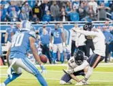  ?? CARLOS OSORIO/AP ?? Cairo Santos kicks the winining field goal as tim expires to lift the Bears over the Lions on Thanksgivi­ng in Detroit. The Lions remained winless this season.