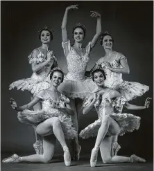  ?? Jim Caldwell ?? Ballerinas Cynthia Drayer, clockwise from bottom left, Janie Parker, Andrea Vodehnal, Suzanne Longley and Katie King danced on the unforgivin­g Jones Hall stage for Houston Ballet.