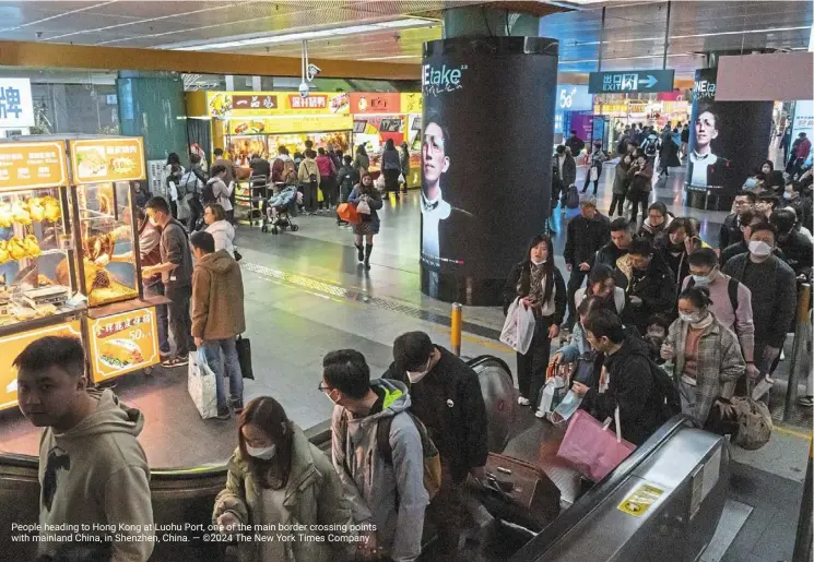  ?? — ©2024 The new york Times Company ?? people heading to Hong Kong at luohu port, one of the main border crossing points with mainland China, in shenzhen, China.