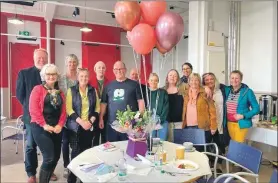  ?? ?? Colleagues and friends helped Eleanor, second from left at the front, celebrate her retiral with a surprise lunch in The Rockfield Centre.