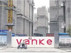 ?? BLOOMBERG ?? Buildings under constructi­on at China Vanke’s ‘Inspiring Mansion’ residentia­l developmen­t in Shanghai on March 19.