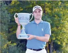  ?? — USA Today Sports ?? Justin Thomas poses with the Dell Technologi­es Championsh­ip trophy after winning the tournament at TPC of Boston.