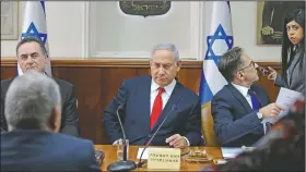  ?? AP/ARIEL SCHALIT ?? Israeli Prime Minister Benjamin Netanyahu holds his weekly Cabinet meeting Sunday in Jerusalem, announcing strikes on Iranian and Hezbollah sites in Syria while praising his departing military chief of staff.