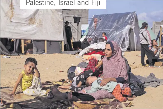  ?? Picture: AP ?? Top: Palestinia­ns displaced by the Israel bombardmem­t of the Gaza Strip set up a tent camp in Rafah.