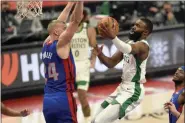  ?? JOSE JUAREZ - FREELANCER, AP ?? Boston Celtics guard Jaylen Brown, right, drives against Detroit Pistons center Mason Plumlee during the first half of an NBA basketball game Sunday, Jan. 3, 2021, in Detroit.