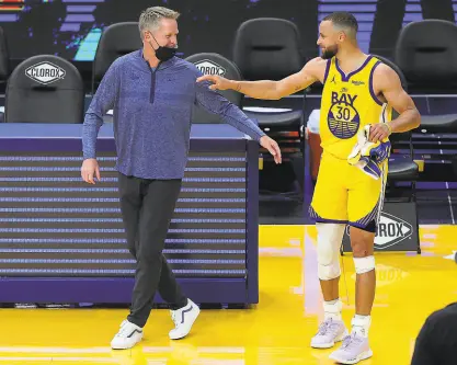  ?? Carlos Avila Gonzalez / The Chronicle ?? Warriors head coach Steve Kerr lamented his team’s inability to gather for team dinners this season, a tradition that often has translated to trust and camaraderi­e on the court in past years.