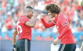  ?? PIC/AP/PTI ?? Manchester United’s Marouane Fellaini celebrates his goal with Antonio Valencia during the first half of the match against the Los Angeles Galaxy