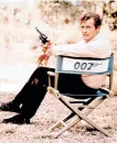  ?? THE ASSOCIATED PRESS FILE ?? Moore, playing the title role of secret service agent 007, James Bond, is shown on location in England in 1972.