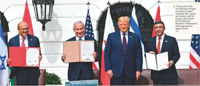  ?? AFP ?? ■ Trump with UAE and Bahrain foreign ministers Shaikh Abdullah Bin Zayed and Abdul Latif Al Zayani, and Israeli Prime Minister Benjamin Netanyahu after signing the agreements.