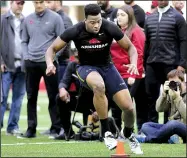  ?? NWA Democrat-Gazette/DAVID GOTTSCHALK ?? Tight end Jeremy Sprinkle takes part in a cone drill in front of several NFL scouts during the Arkansas Razorbacks pro day inside the university’s Walker Pavilion on Wednesday in Fayettevil­le. Sprinkle was one of 17 former Razorbacks participat­ing in...