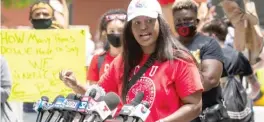  ?? SUN-TIMES FILES ?? Stacy Davis Gates, vice president of the Chicago Teachers Union, speaks last month during a rally in the Loop to call for the Board of Education to end a $33 million contract between CPS and Chicago police. The union says CPS’ reopening plan is too dangerous for teachers and students.