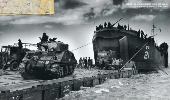  ??  ?? USS LST-21 unloads British tanks and trucks on a Normandy beach, 6 June 1944