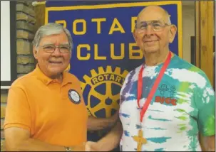  ?? Submitted photo ?? AIDING YOUTH: Rotary Club of Hot Springs Village member Clif Haygood, left, recently welcomed guest speaker Bill Monson, who presented about the children helped through the Dick Johnston Camp.