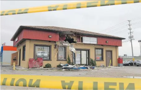  ?? DAN JANISSE ?? The damage to a Leamington building struck by an airborne pickup truck is shown in this Oct. 23, 2012, file photo. The passenger was killed, the driver convicted of murder.