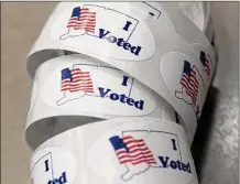  ?? Ned Gerard/Hearst Connecticu­t Media ?? Stickers await voters on Election Day at Foran High School, in Milford, last year.