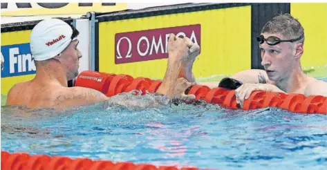  ?? FOTO: KISBENEDEK/AFP ?? Der Ukrainer Mykhailo Romanchuk (links) und Florian Wellbrock, die zusammen trainieren, dominierte­n den Vorlauf über 1500 Meter.