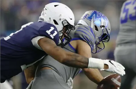  ?? Ronald Martinez/Getty Images ?? Micah Parsons sacks Memphis quarterbac­k Brady White Saturday in the Cotton Bowl Classic — one of his 14 tackles.