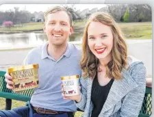  ?? [PHOTO BY NATE BILLINGS, THE OKLAHOMAN] ?? During an outing a Tulsa’s Minshall Park, Luke Balke and Lauryn Schack show the Blue Bell ice cream containers that were part of Balke’s wedding proposal.