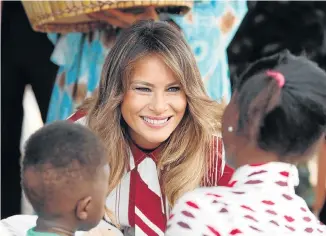  ?? Picture: REUTERS ?? CHARM OFFENSIVE: US first lady Melania Trump greets children during a visit to a hospital in Accra, Ghana, on Tuesday